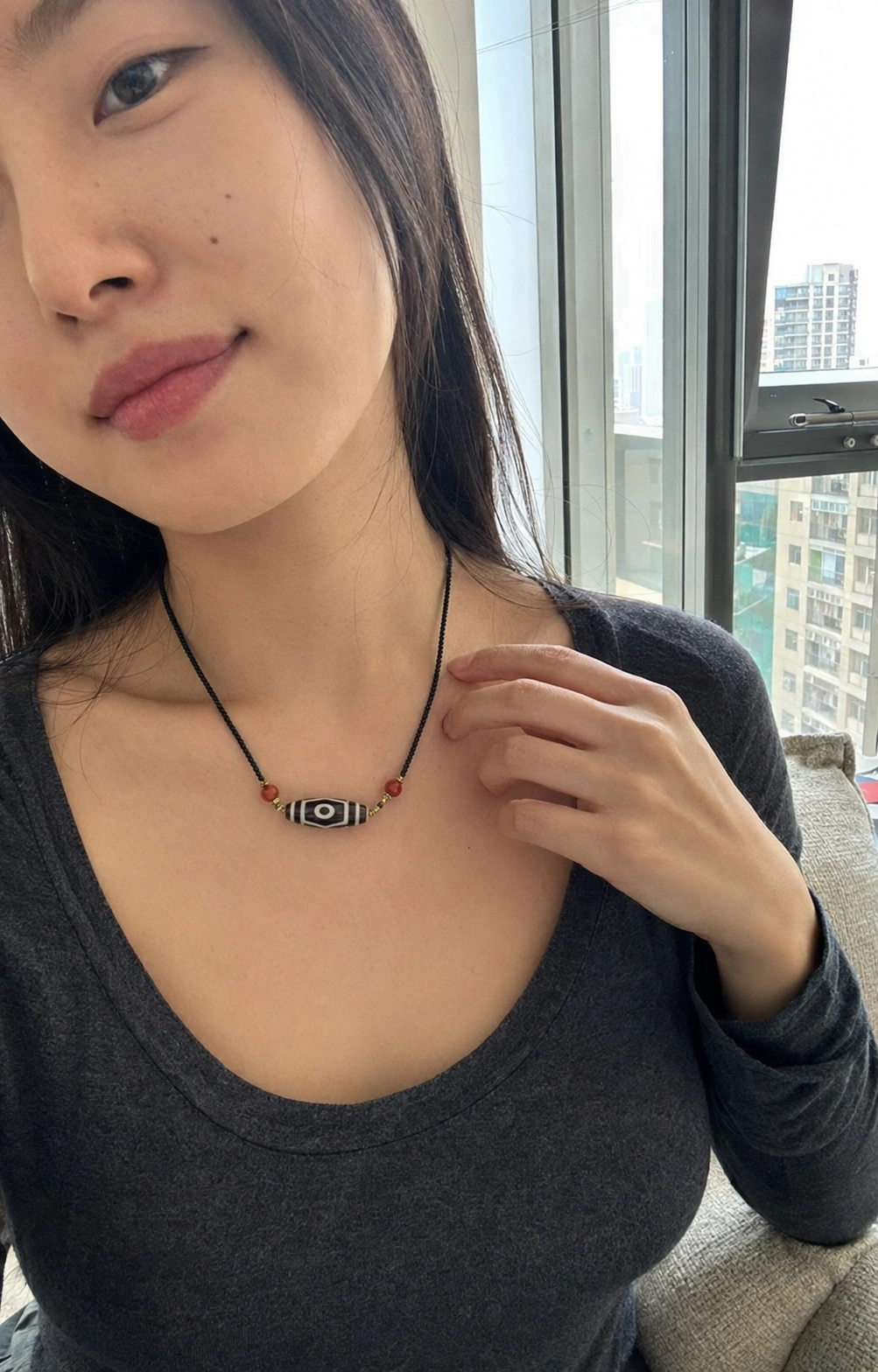 Dzi necklace worn in everyday life