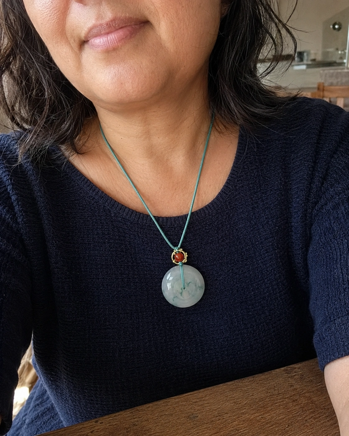 Symbolic necklace worn by a customer